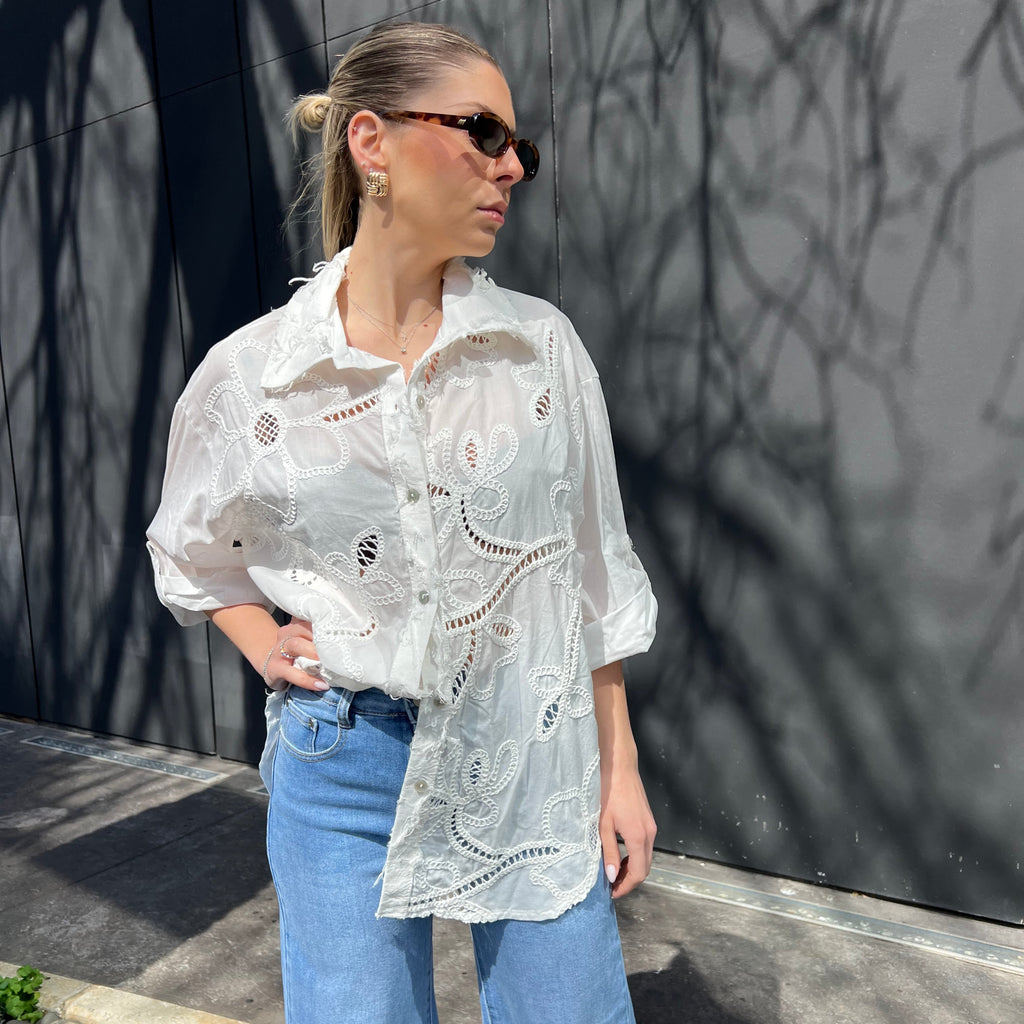 White shirt with embroidered patterns