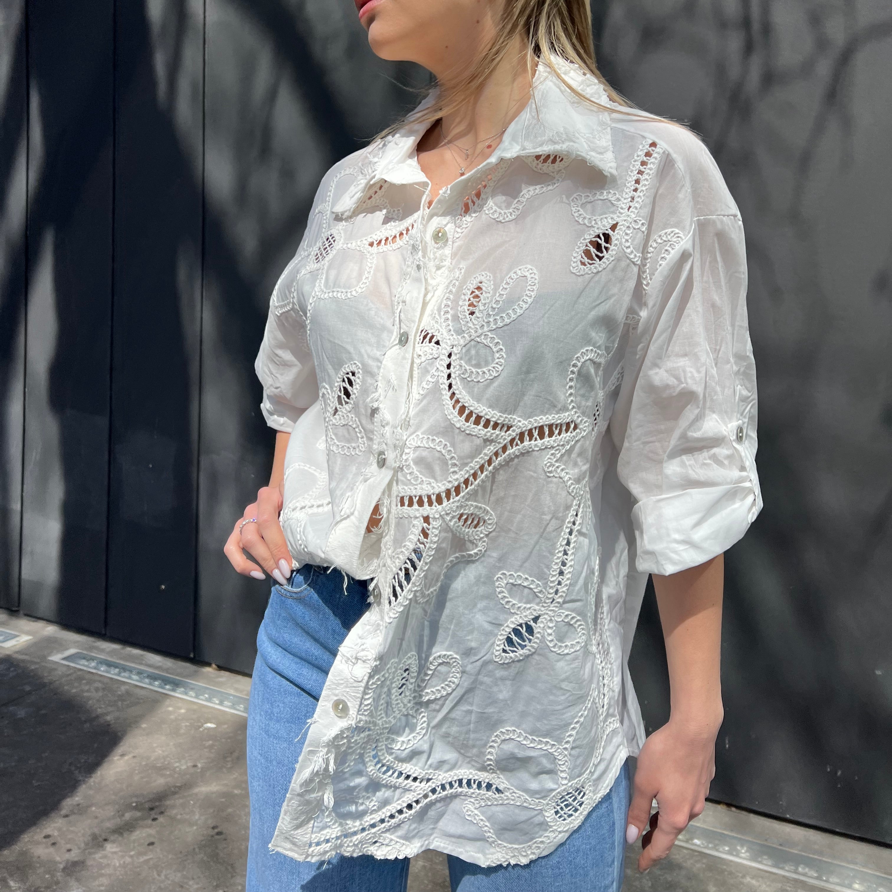 White shirt with embroidered patterns